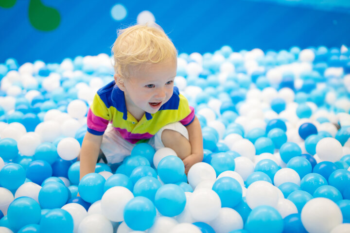 Kids Play In Ball Pit. Child Playing In Balls Pool